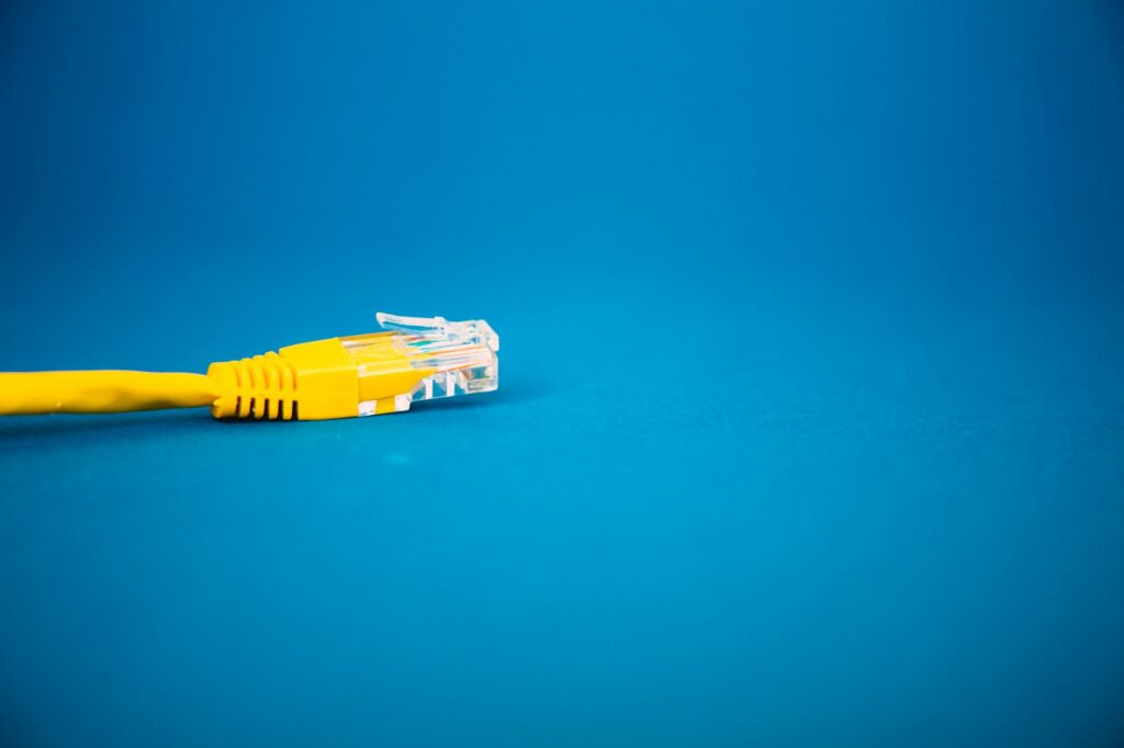 Yellow USB cable on blue background