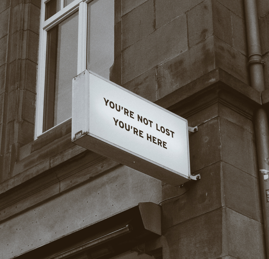 Sign reads 'you're not lost, you're home'